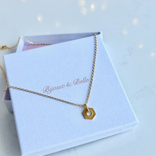 Gold Hexagon Necklace resting on a white jewellery box with "Bijoux & Belle" branding